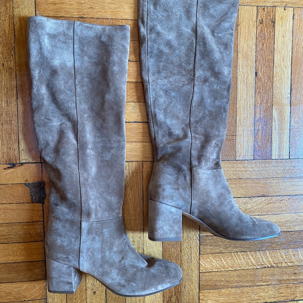 Worn with love, knee-high suede boots